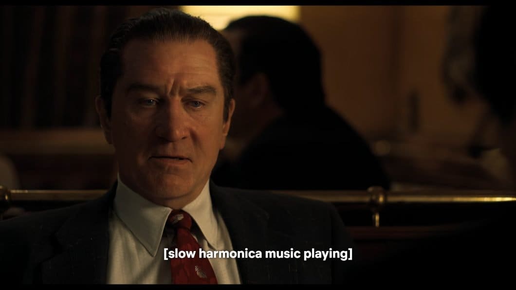 Still from the film The Irishman showing Robert De Niro's de-aged face.